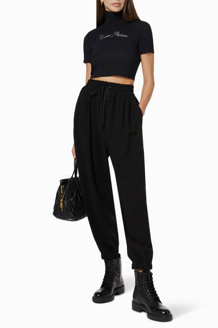 hover state of Embroidered Logo Turtleneck Cropped Top in Stretch Georgette  