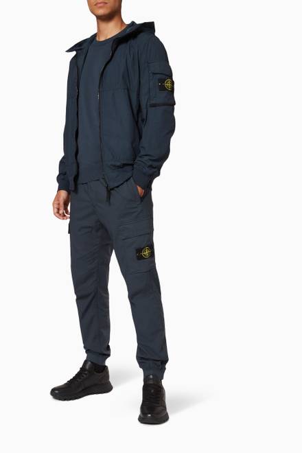hover state of Compass Badge Lightweight Hooded Jacket in Nylon 