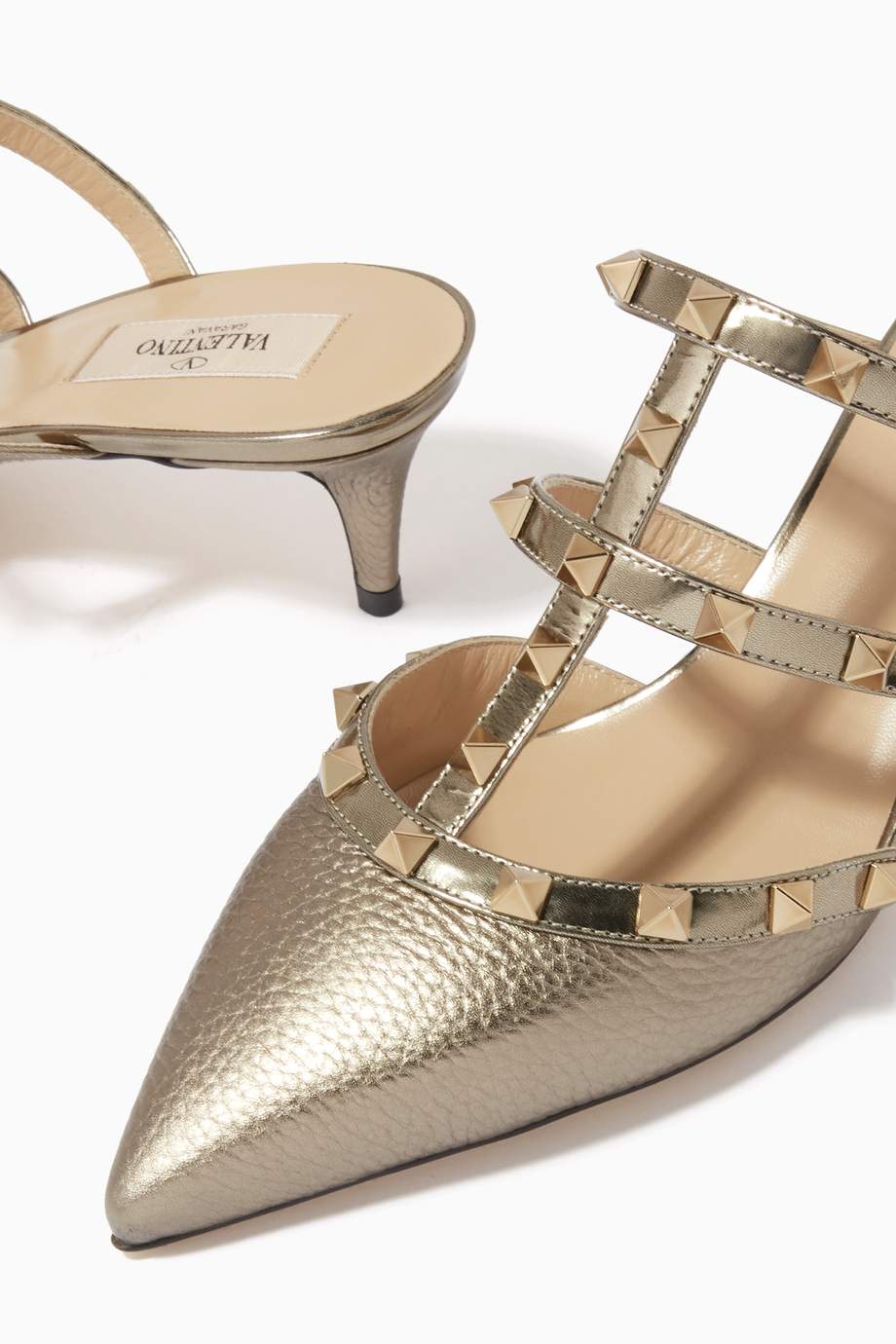 Shop Valentino Gold Valentino Garavani Rockstud Caged Mules in Metallic Grained Leather for 
