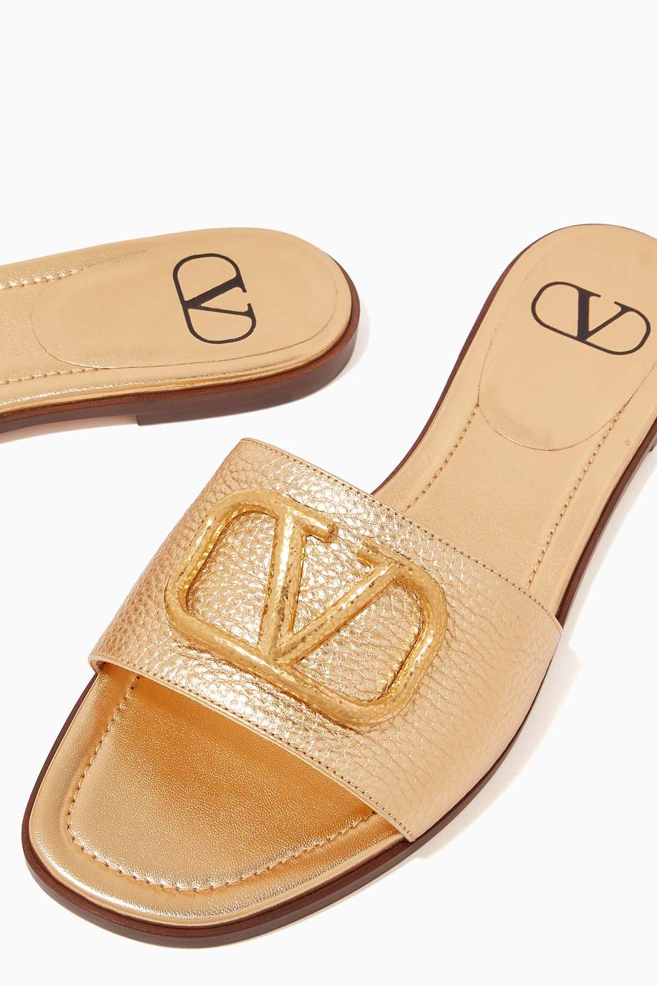 Shop Valentino Gold Valentino Garavani VLOGO Slides in Metallic