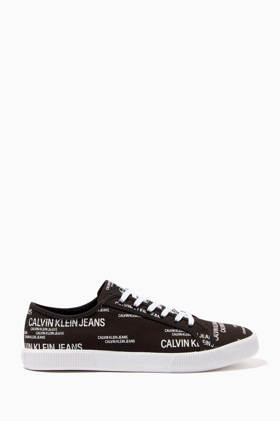Shop Calvin Klein Jeans Black Canvas Vulcanized Sneakers for Men ...