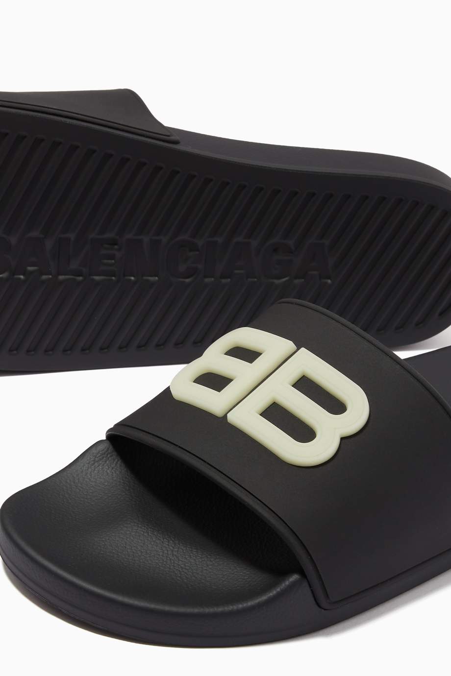 Shop Balenciaga Black GITD BB Pool Slides in Rubber for Women | Ounass UAE