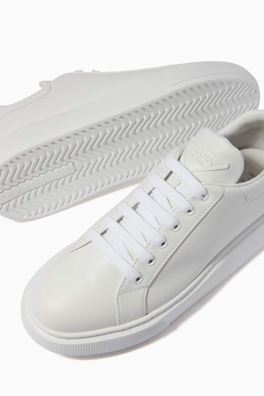 Shop Prada White Triangle Logo Sneakers in Calf Leather for Women ...