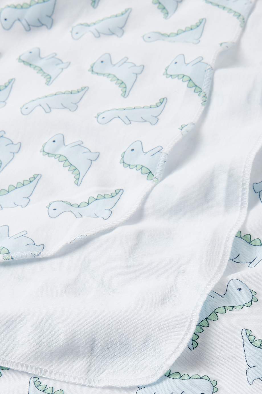 Shop Magnolia Baby Blue Dinosaur Swaddle Blanket in Pima Cotton for