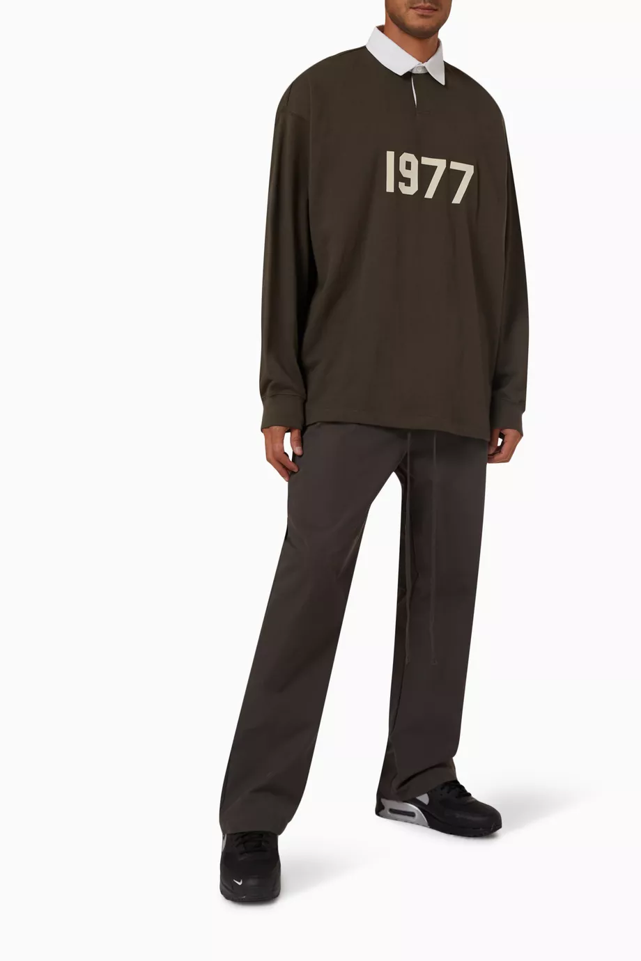 Shop Fear of God Essentials Black Henley Rugby Polo Shirt in 